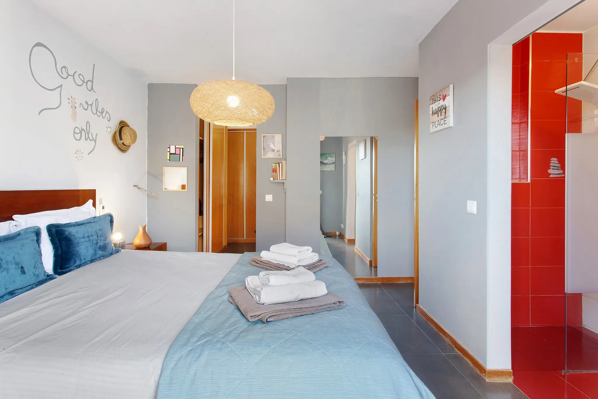 Bright master en-suite bedroom with double bed and walk-in shower