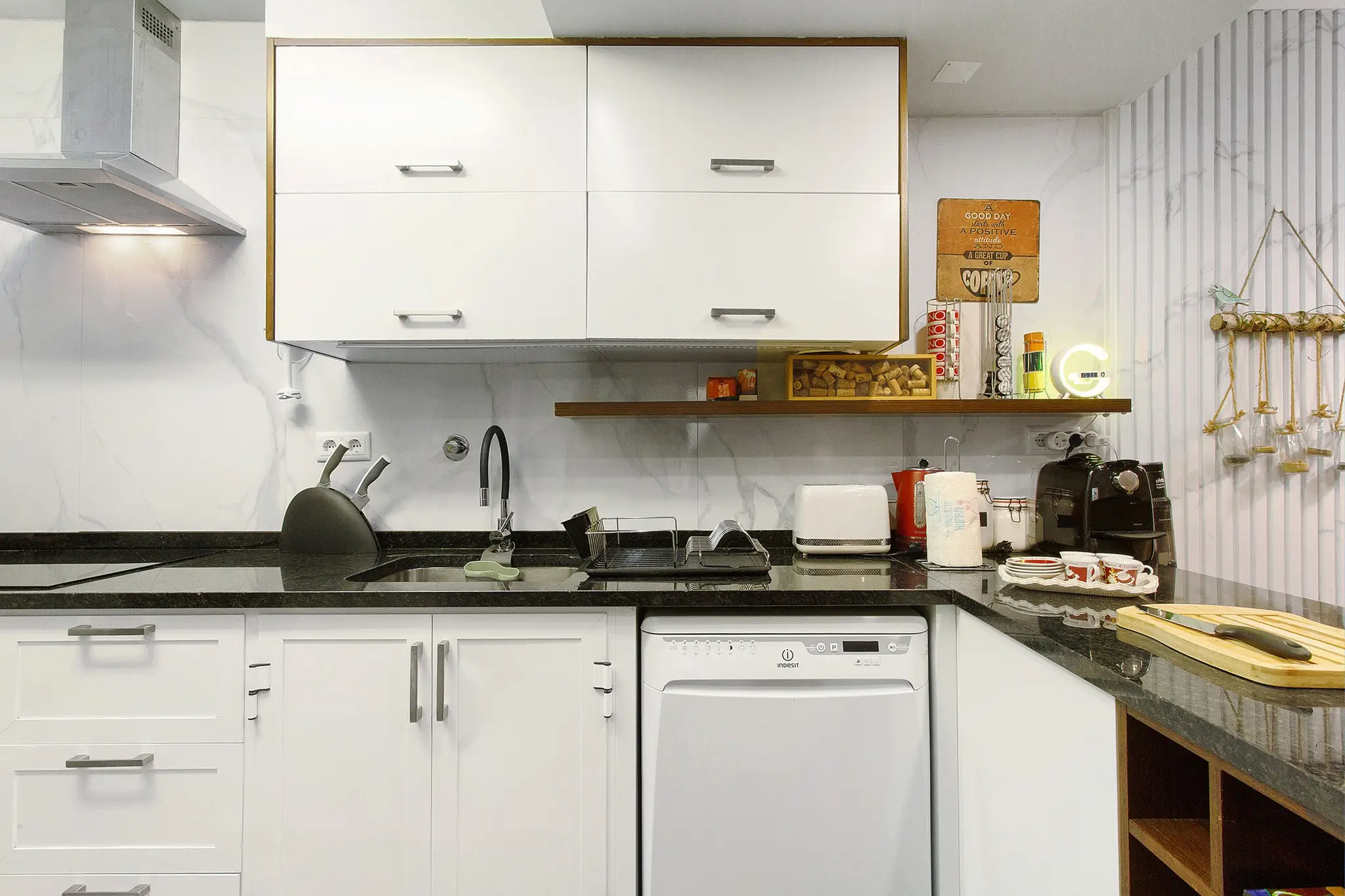 Kitchen counter with coffee machine, kettle and cooking essentials