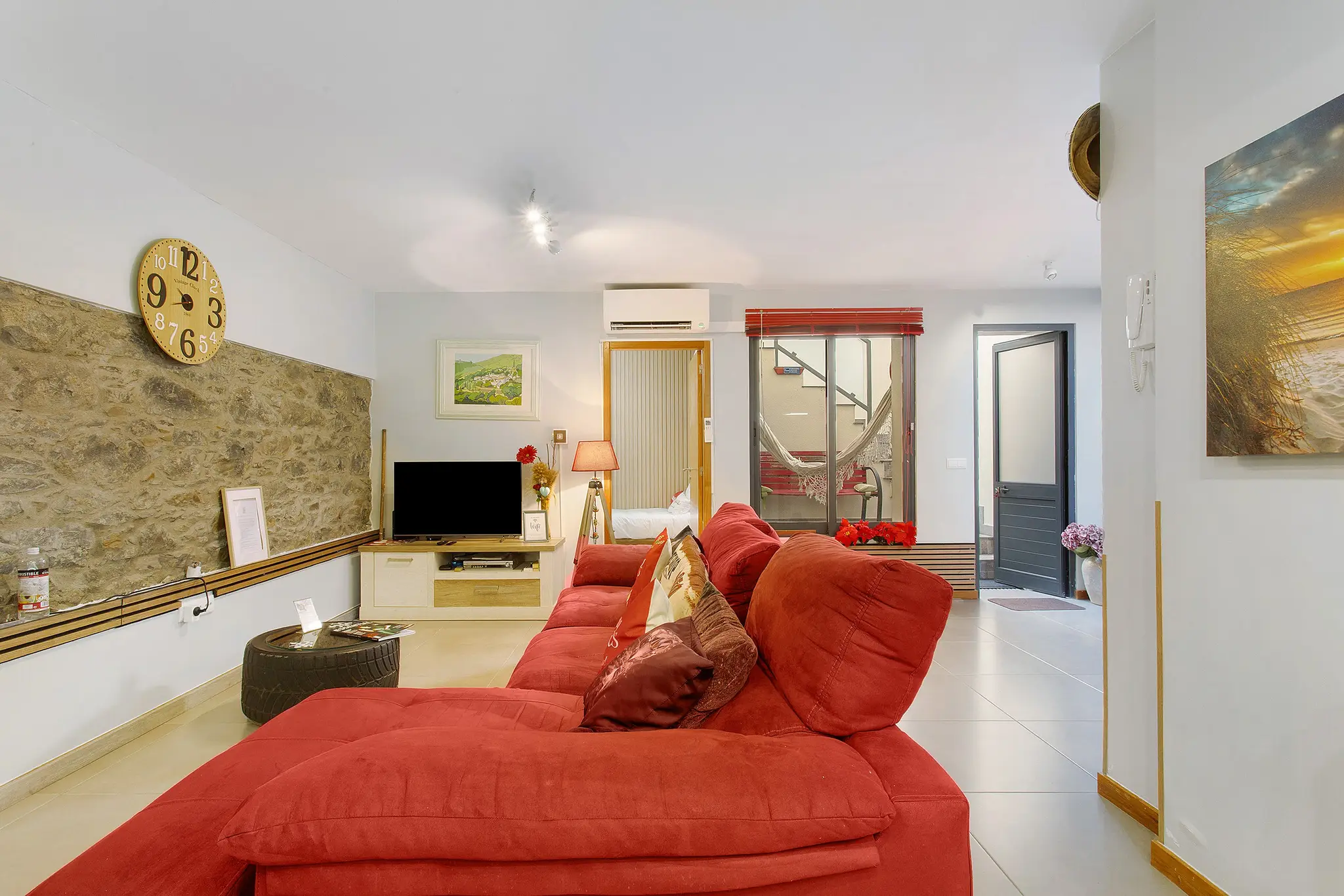 Lounge with view towards the third bedroom next to the living room